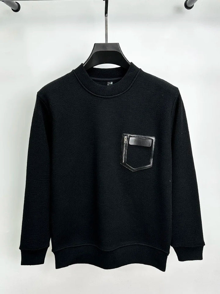 Suéter con costuras de cuero